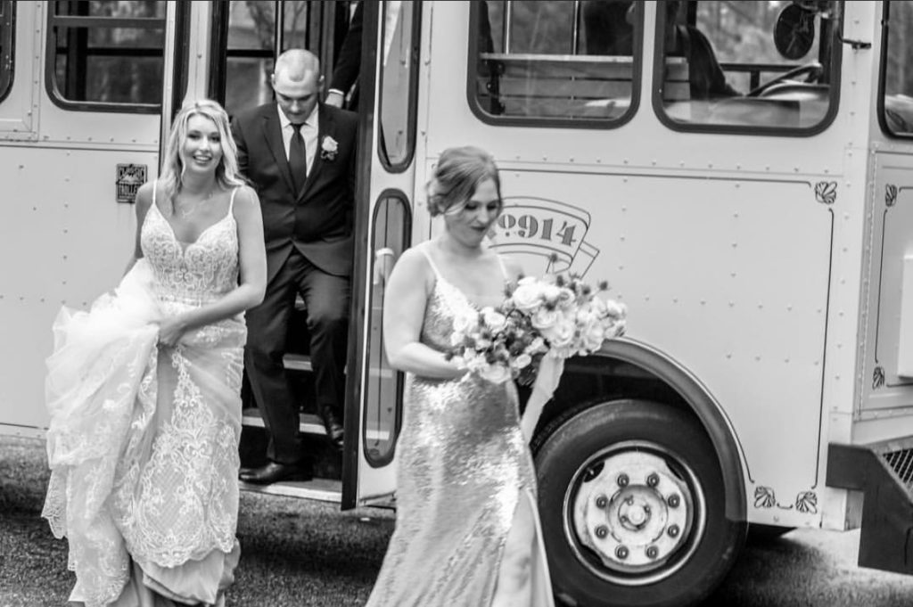 exiting bus shuttle wedding obx wedding flowers