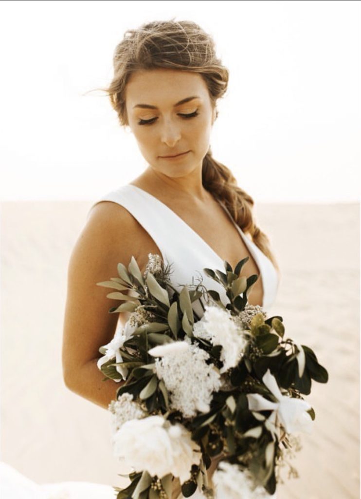 white dress brunette bride outer banks beach wedding obx wedding flowers
