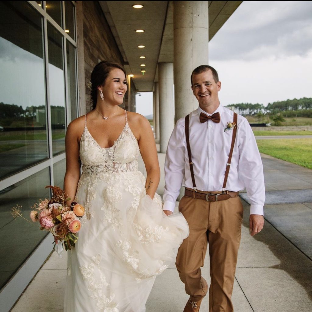 smiling couple outer banks beach wedding obx wedding flowers
