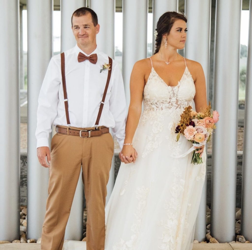 couple at outer banks beach wedding obx wedding flowers